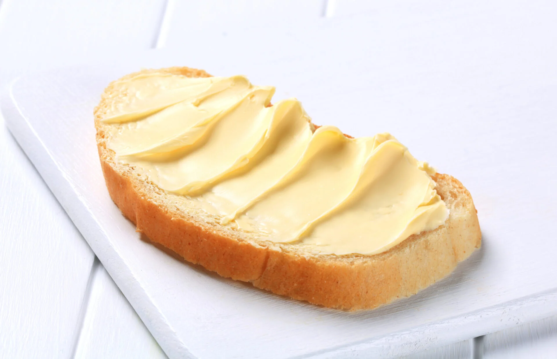 Slice of white bread with butter