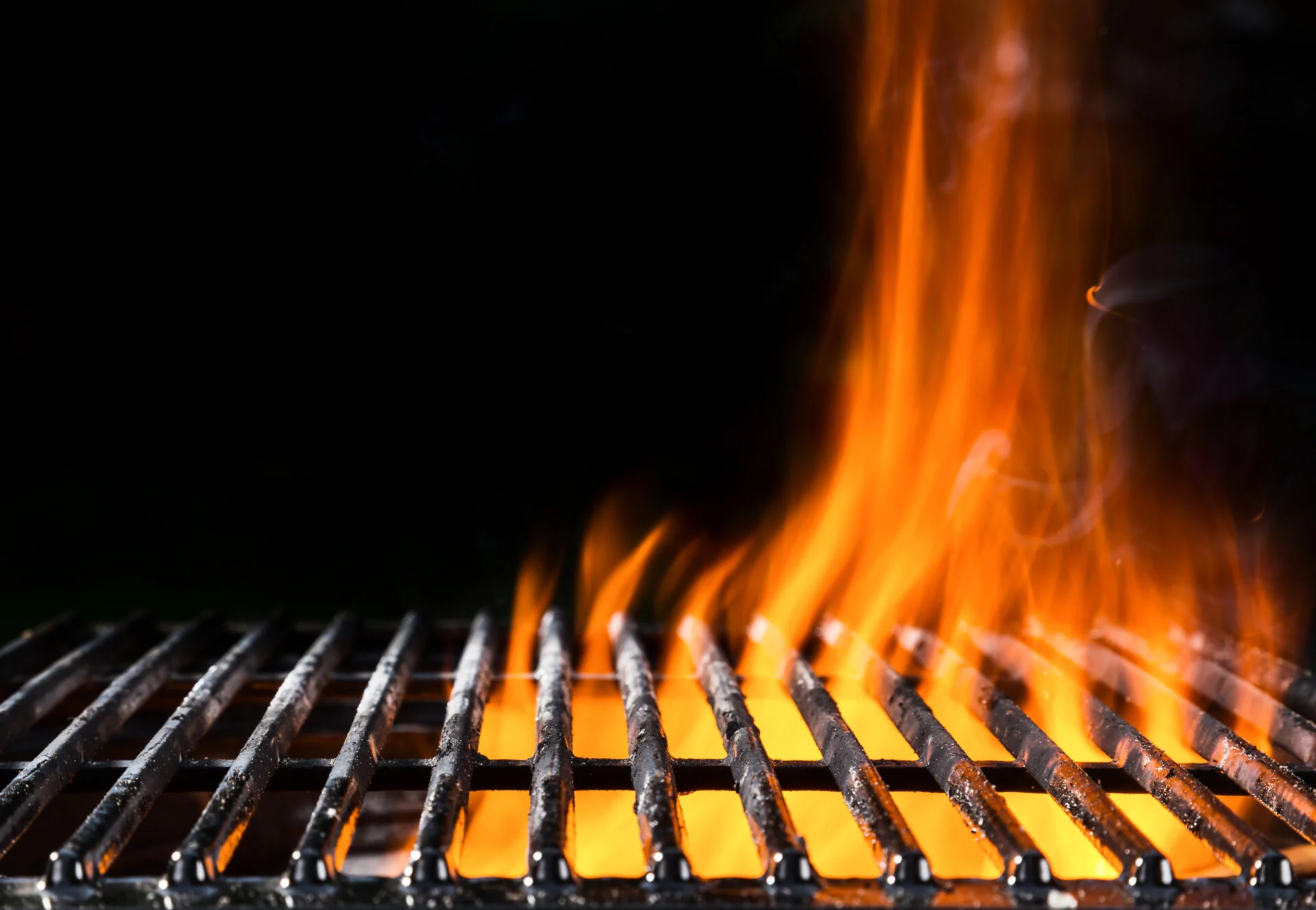 Empty grill grid in fire with black background