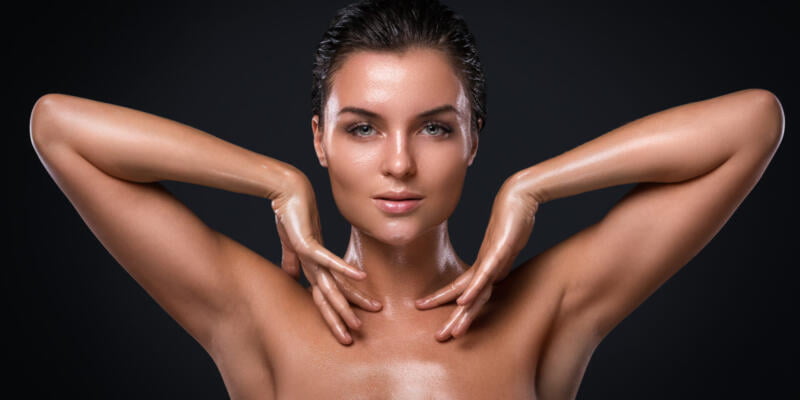 Potrait of young beautiful woman with oily and wet skin