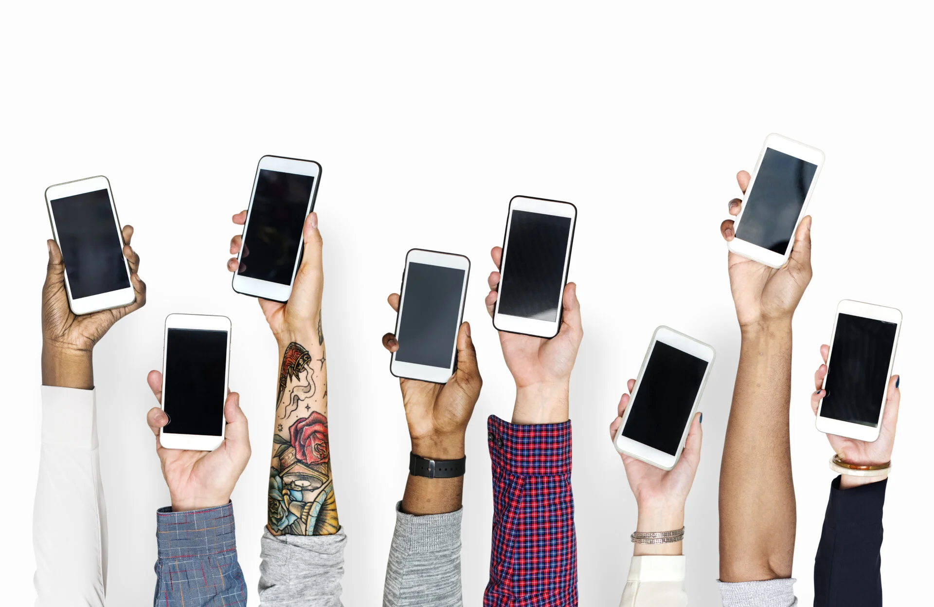 People holding up their mobile phones against a white background