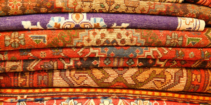 Rugs folded up one on top of another
