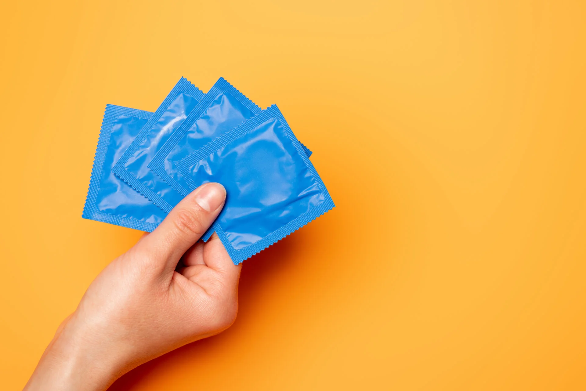 Condoms held by woman