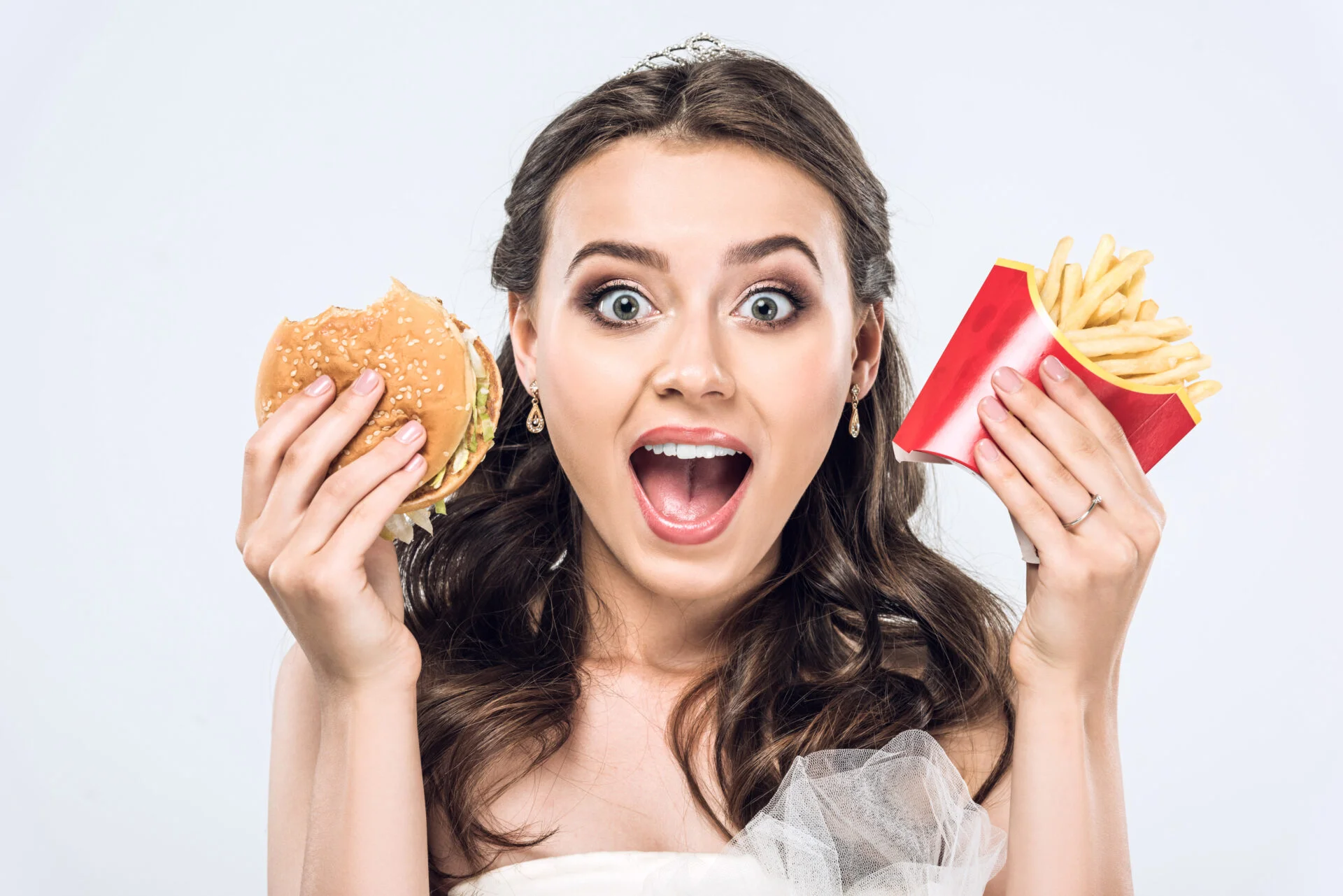 Woman holding fast food 