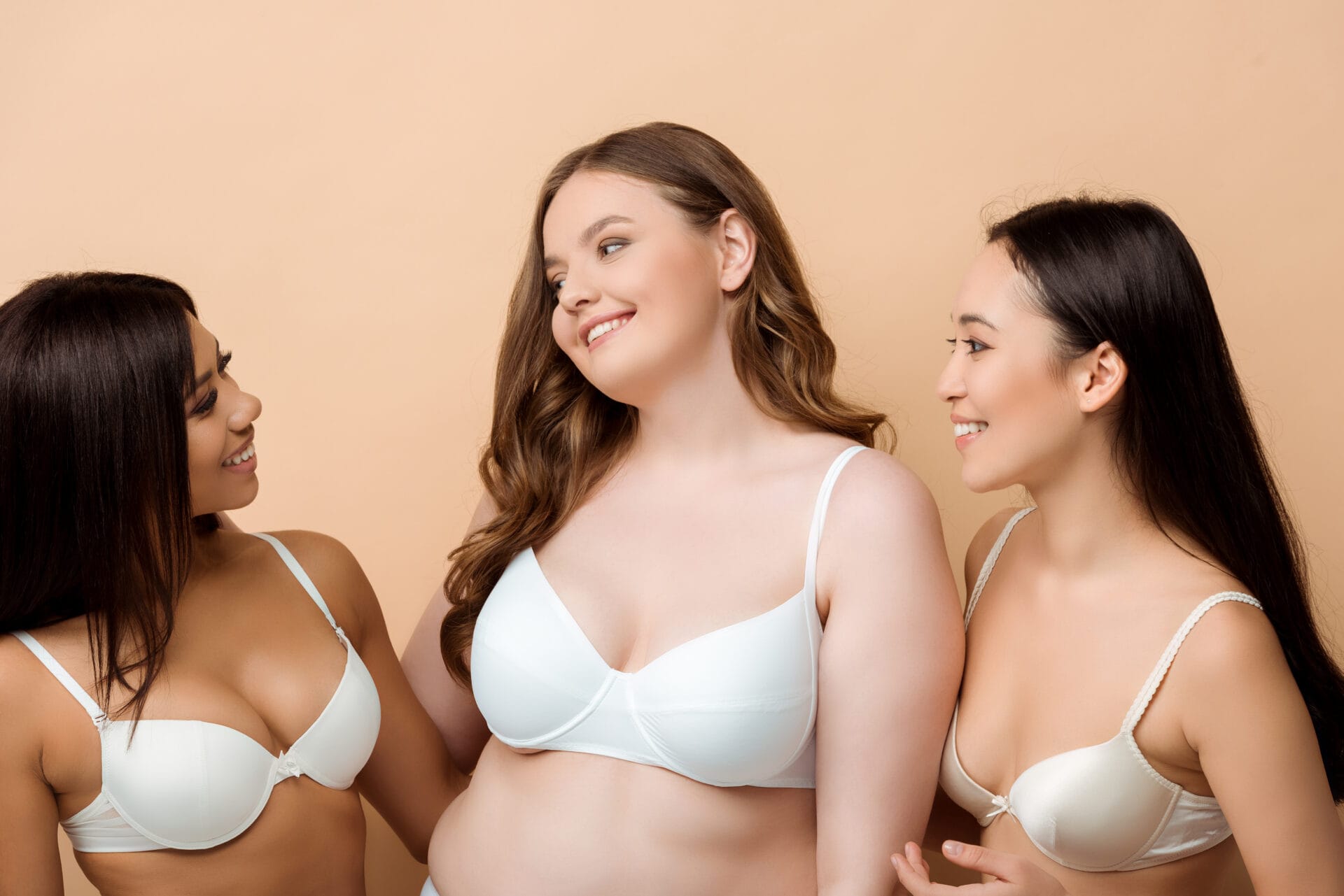 Three women in their bras chatting