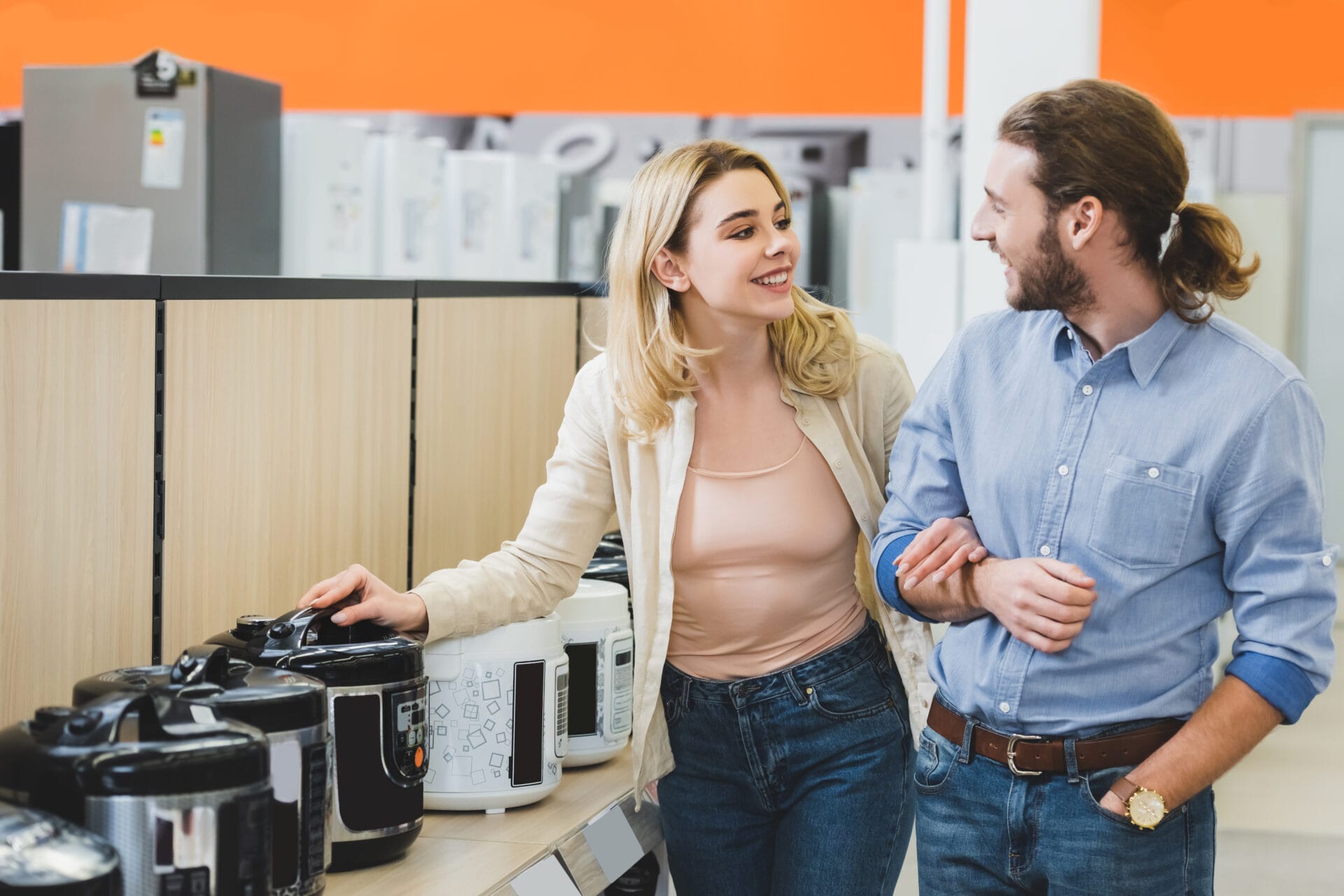 Couple shopping for slow cookers