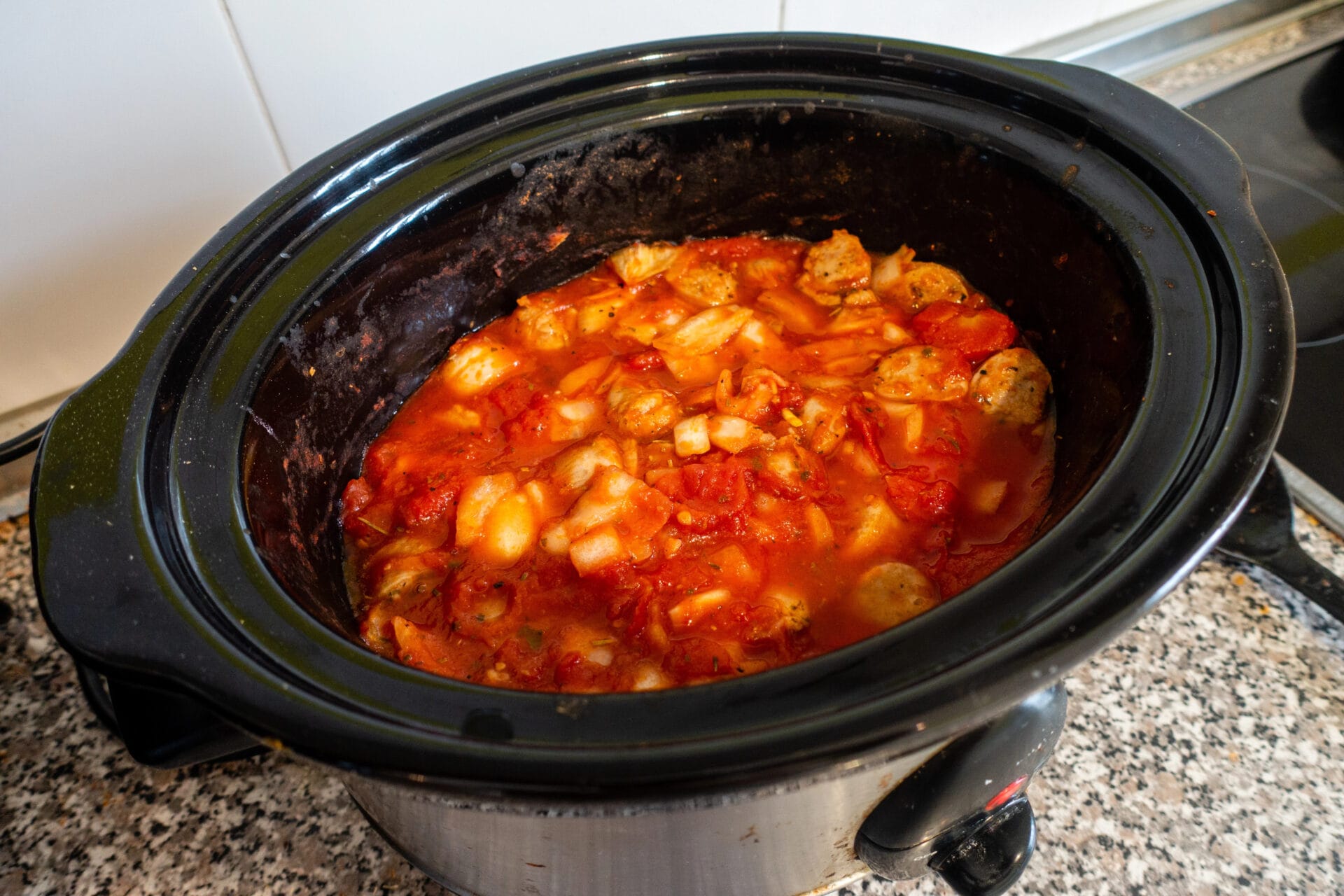 Slow cooker on the counter cooking chili